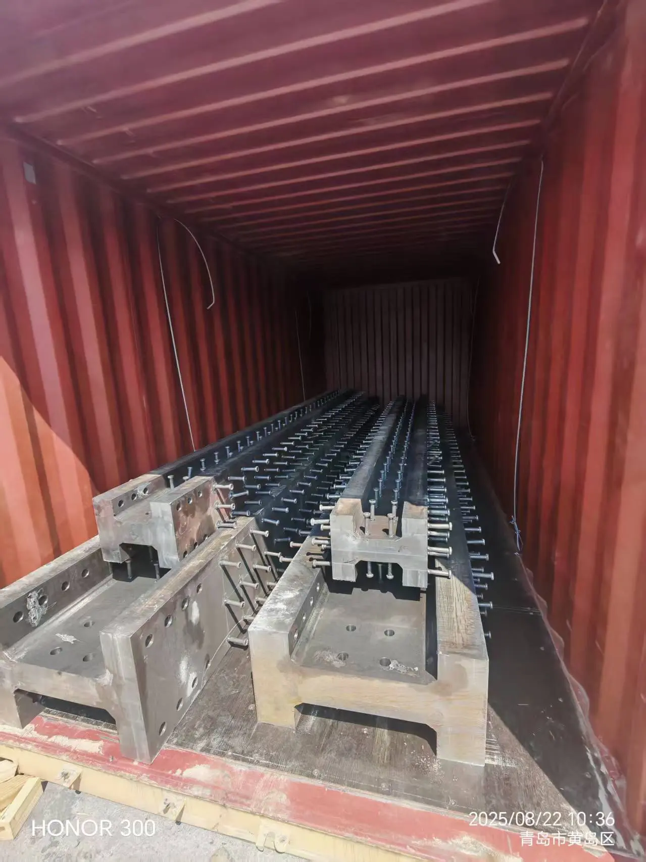 Trucks loading section steel for an infrastructure project shipment