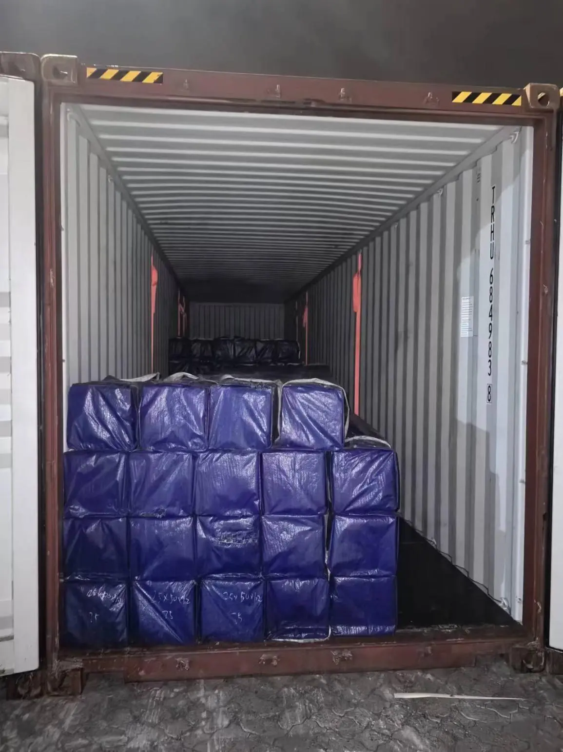 Heavy steel bundles being loaded for an infrastructure project shipment