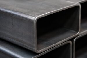 Close-up view of EN10219 S355JR structural steel pipes showing smooth surface finish and precise corner radii